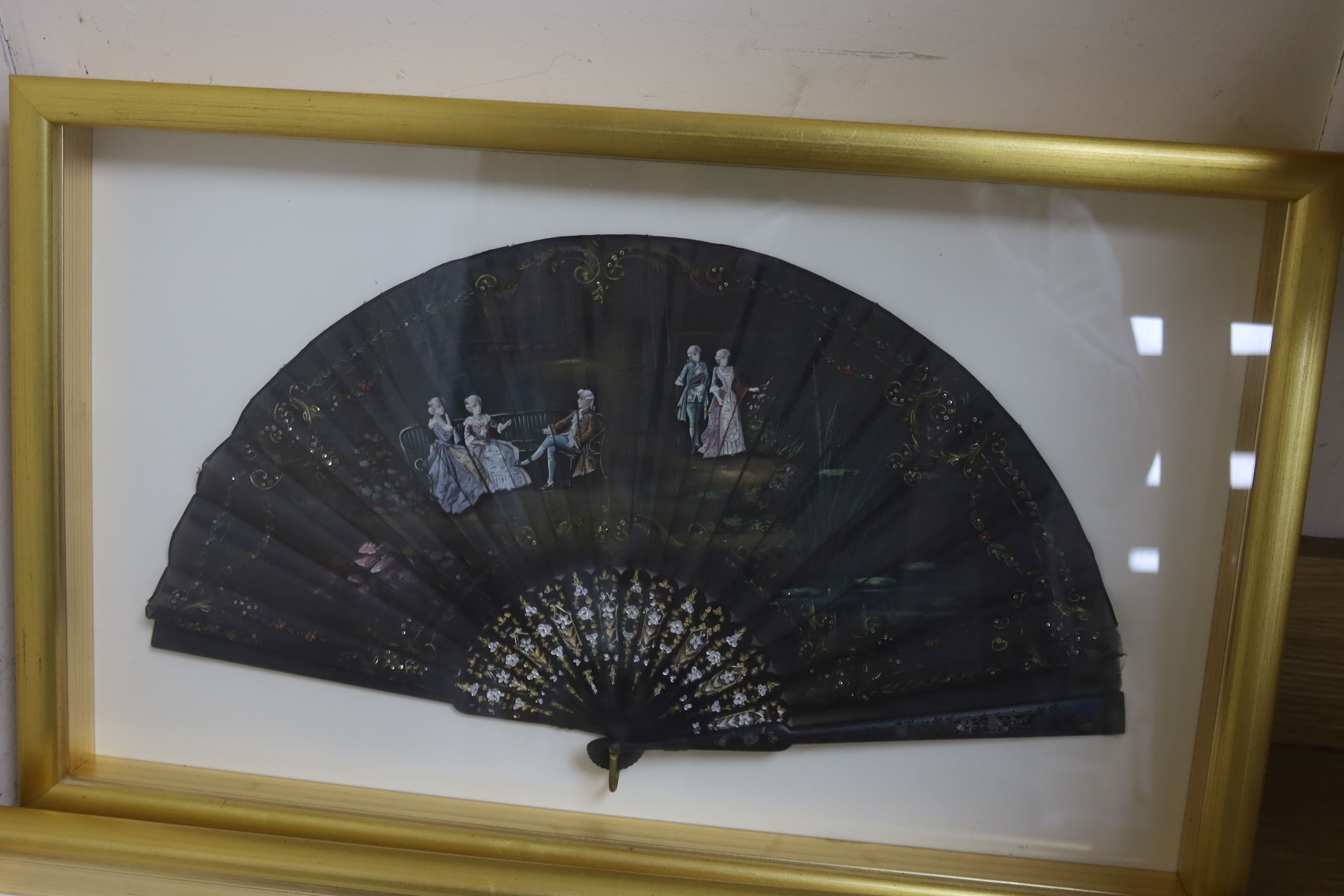 Three 19th century black sequin mounted fans, One hand painted, largest case 38.5 x 60.5 cm